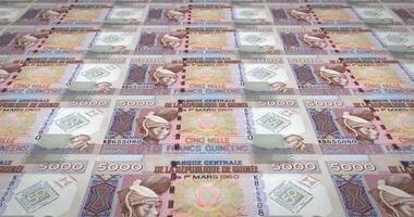 Banknotes of five thousand guinean francs rolling, cash money, loop video
