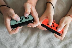 Hands using game controller. Playing games photo