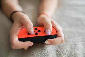 Hands using game controller. Playing games photo