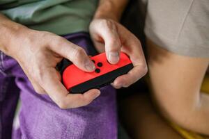 Hands using game controller. Playing games photo