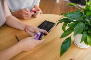 Hands using game controller. Playing games photo