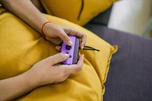 Hands using game controller. Playing games photo