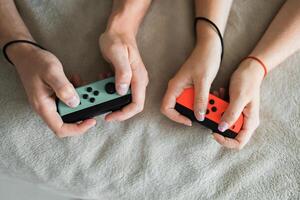 Hands using game controller. Playing games photo
