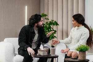 Therapy session, a serious family couple seeks support and consulting from a psychologist to address and resolve underlying problems. Positive impact of psychotherapy photo