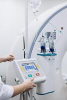 Close-up of control panel CT. A medical technician assists a patient undergoing an MRI scan, showcasing professionalism and modern medical technology in a healthcare setting. Vertical shot photo