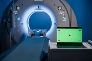 MRI CT Scanned image show on computer in DataCenter operation room. Green screen for text display on laptop. Technologies and innovations in medical research. photo