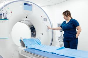 A medical nurse, doctor operates a modern MRI scanner while attending to a patient in a medical facility. The scene highlights advanced technology and healthcare support for diagnostic imaging photo