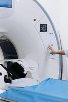 MRI machine with a close-up of the control panel and adjustment buttons, enabling high-precision diagnostics and maximum efficiency. Concept of innovative medical technologies. Vertical shot photo
