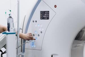MRI machine with a close-up of the control panel and adjustment buttons, enabling high-precision diagnostics and maximum efficiency. Concept of medical technologies photo