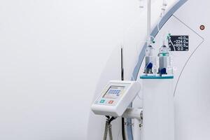 Close-up of a contrast agent before diagnostics in a CT room. The concept of using innovative technologies for accurate vascular examinations. Medicine concept, free copy space, banner, advertising photo