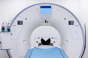 MRI magnetic resonance imaging device. Medical CT, MRI or PET Scan in the Modern Hospital Laboratory. Technologically Advanced and Functional Medical Equipment in a Clean White Room. Free copy space photo