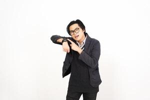 A man in glasses and a jacket pointing at something photo