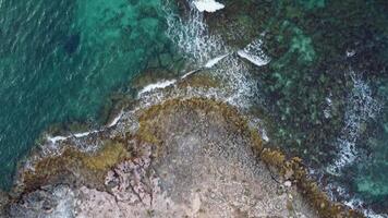 Top down view clear water of Mediterranean sea in Puglia, southern Italy. Aerial view sea with rocky coast video