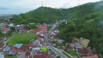 Aerial view of a small town in the middle of the mountains video