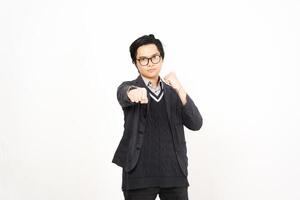 A man in glasses and a sweater pointing at something photo