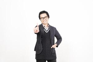 A man in glasses and a sweater is pointing at something photo