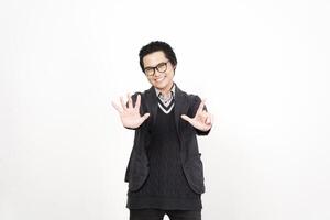 A man in glasses and a sweater is making a gesture photo
