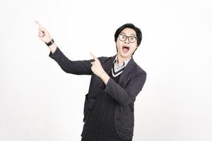 A man in glasses and a sweater pointing at something photo