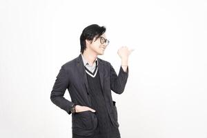 A man in glasses and a suit is pointing at something photo