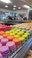 A display case filled with colorful macarons photo