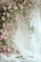 A white background with pink roses and white fabric photo