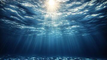 Underwater scene with sunbeams shining through the water photo