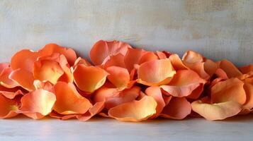 Orange rose petals arranged in a vase photo