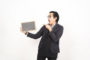 A man holding a blackboard and pointing at it photo