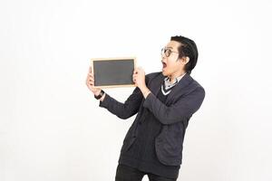 A man holding a blackboard while looking at it photo