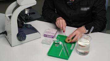 Scientist Preparing Sample for Microscope Analysis video