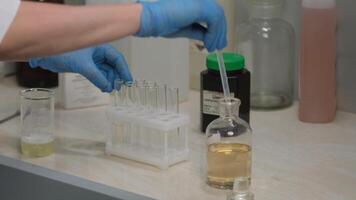 Scientist Using Pipette to Transfer Liquid in Laboratory video