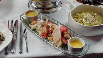 Lobster dish with dipping sauce and cucumber salad video