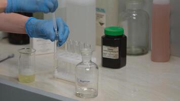 Scientist Using Pipette to Transfer Liquid in Laboratory video