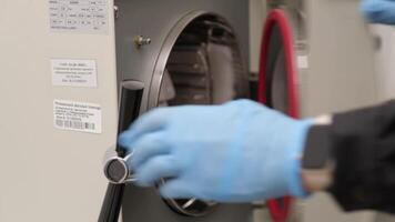Scientist Using Laboratory Autoclave for Sterilization video