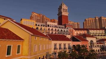 Scenic view of colorful buildings and iconic clock tower during sunset video