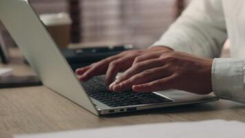 Unrecognizable Caucasian hands developer worker entrepreneur guy executive typing computer laptop in office employer man working businessman male searching information in Internet cyberspace business video