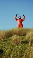 Astronaut Excited About Discovering A New Planet On Top Of Mountain video