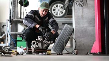 Car Mechanic Repairing Brakes. Car repair theme. video