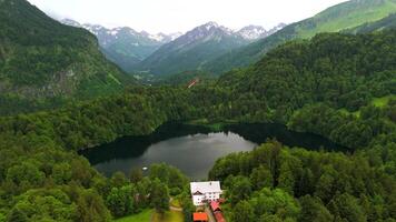 Drone views of Freibergsee and Heini-Klopfer- Schkiflugschanze in Bavaria, Germany. Surrounded by mountains and forests, this pristine lake and famous ski jump is an aerial view of area. Oberstdorf. video