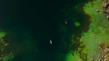 Hintersee in Ramsau, Germany, captured from above in autumn, reveals turquoise waters, majestic Alps, and enchanting Magic Forest. Explore this serene lake with boat rentals, perfect for relaxation. video