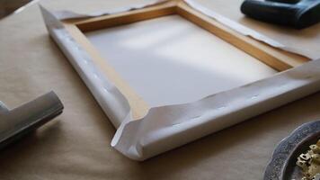 Canvas print. Process of stretching canvas on stretcher frame. Tools and accessories. video
