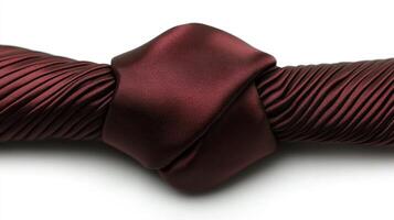 Maroon silk fabric knotted, pleated texture, white background, fashion design photo