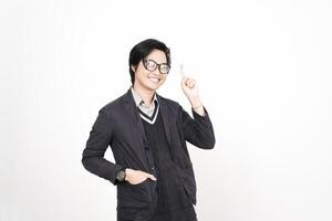 A man in glasses and a jacket is pointing to something photo