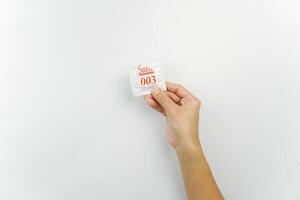 A person holding a small piece of paper with the word salve on it photo