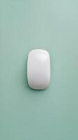 A white square light bulb on a green background photo