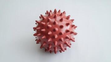 A red ball with spikes on it photo