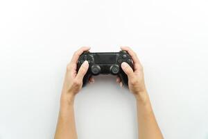 Hands holding a game controller on a white background photo