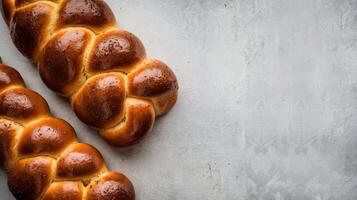 Sabbath kiddush ceremony composition challah bread freshly baked homemade brded challah bread for shabbat and holidays on light grey background shabbat shalom top view copy space photo