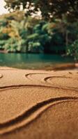A sand drawing on the beach with trees in the background photo