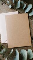 Kraft envelope with eucalyptus leaves photo